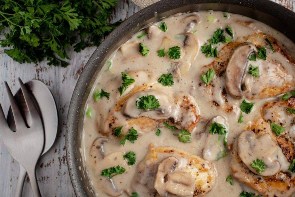 Cream of Mushroom and Chicken in a large sauce pan sprinkled with parsley