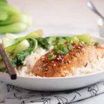 Easy Sweet and Sour Salmon served in a white bowl with box Choy and rice