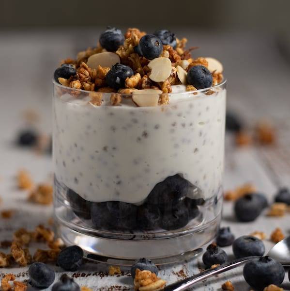 Blueberry Chia Seed Yogurt Snack served in a glass topped with granola
