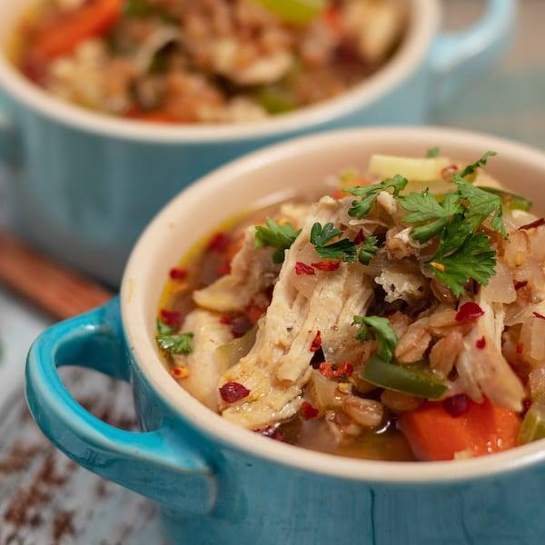 Chicken and Farro Soup Severs in small blue dishes. 