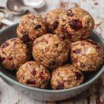 Cranberry Oatmeal Peanut Butter Bliss Balls in a blue bowl Meal Prep Meal planning Counting Macros Macro Friendly