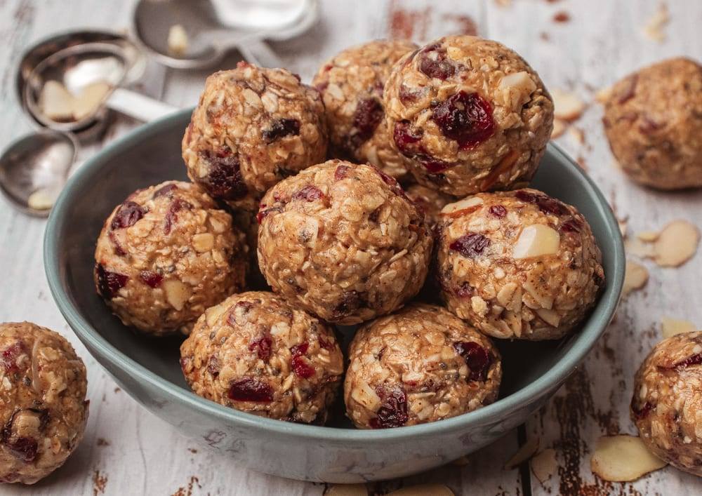 Cranberry Oatmeal Peanut Butter Bliss Balls in a blue bowl Meal Prep Meal planning Counting Macros Macro Friendly